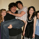 Dan Schneider (center, in black) posing with the stars of iCarly, including Jeanette McCurdy (left).